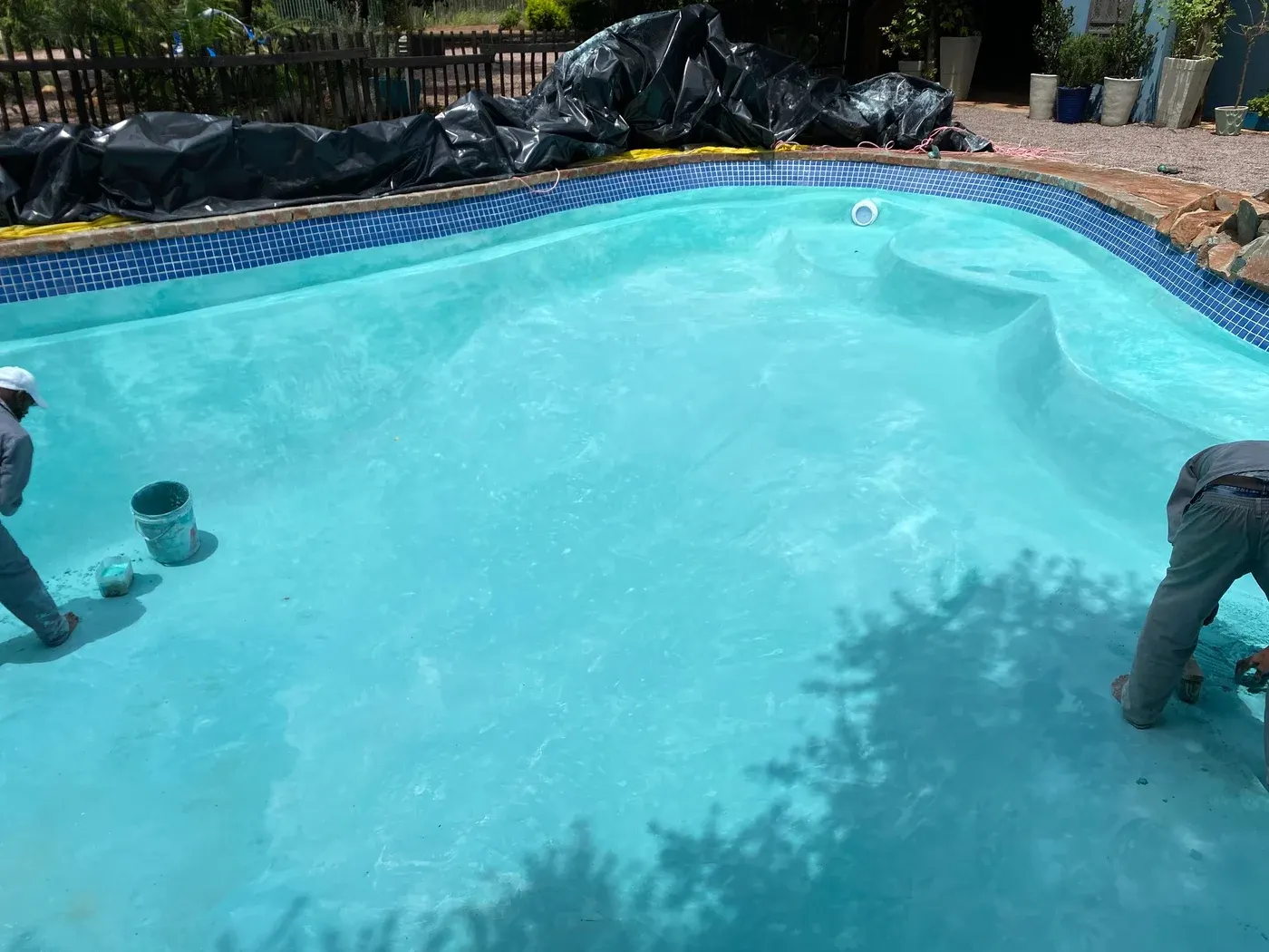 Pool coating being applied to a pool shell on site in Botswana