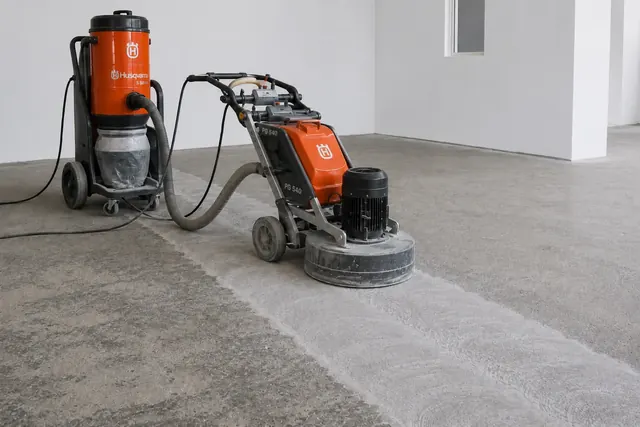 Concrete surface preparation by grinding before structural bonding, Botswana